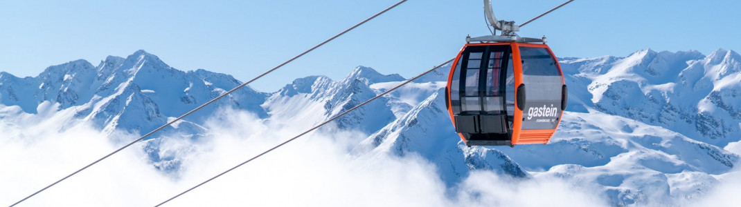 In knalligem orange leuchten die Kabinen der neuen Schlossalm-Bahn