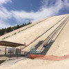 A modern lift takes visitors up the hill.